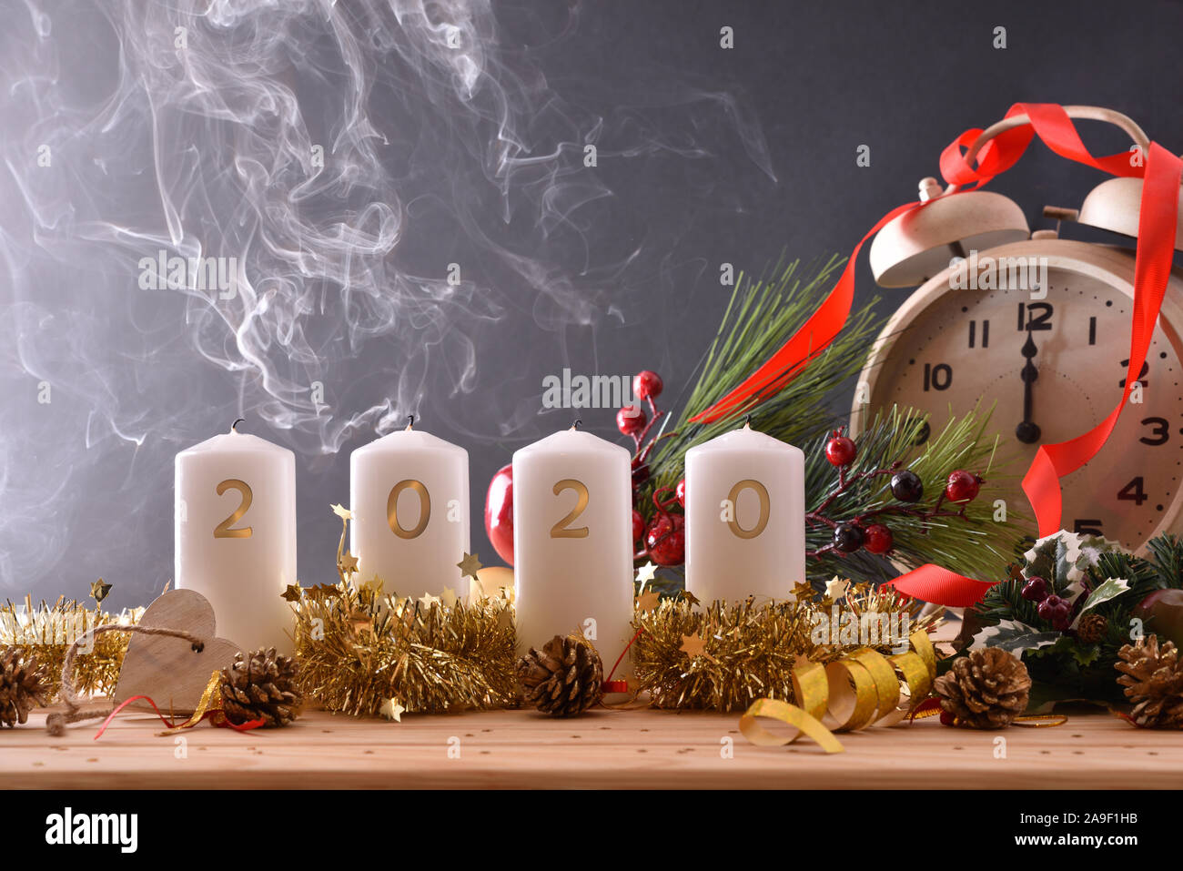 Newly Extinguished Candles In The New Year 2020 On Wooden Table