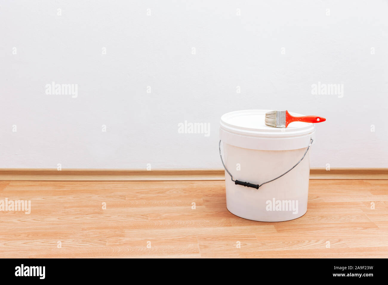 Paint bucket with brush Stock Photo Alamy