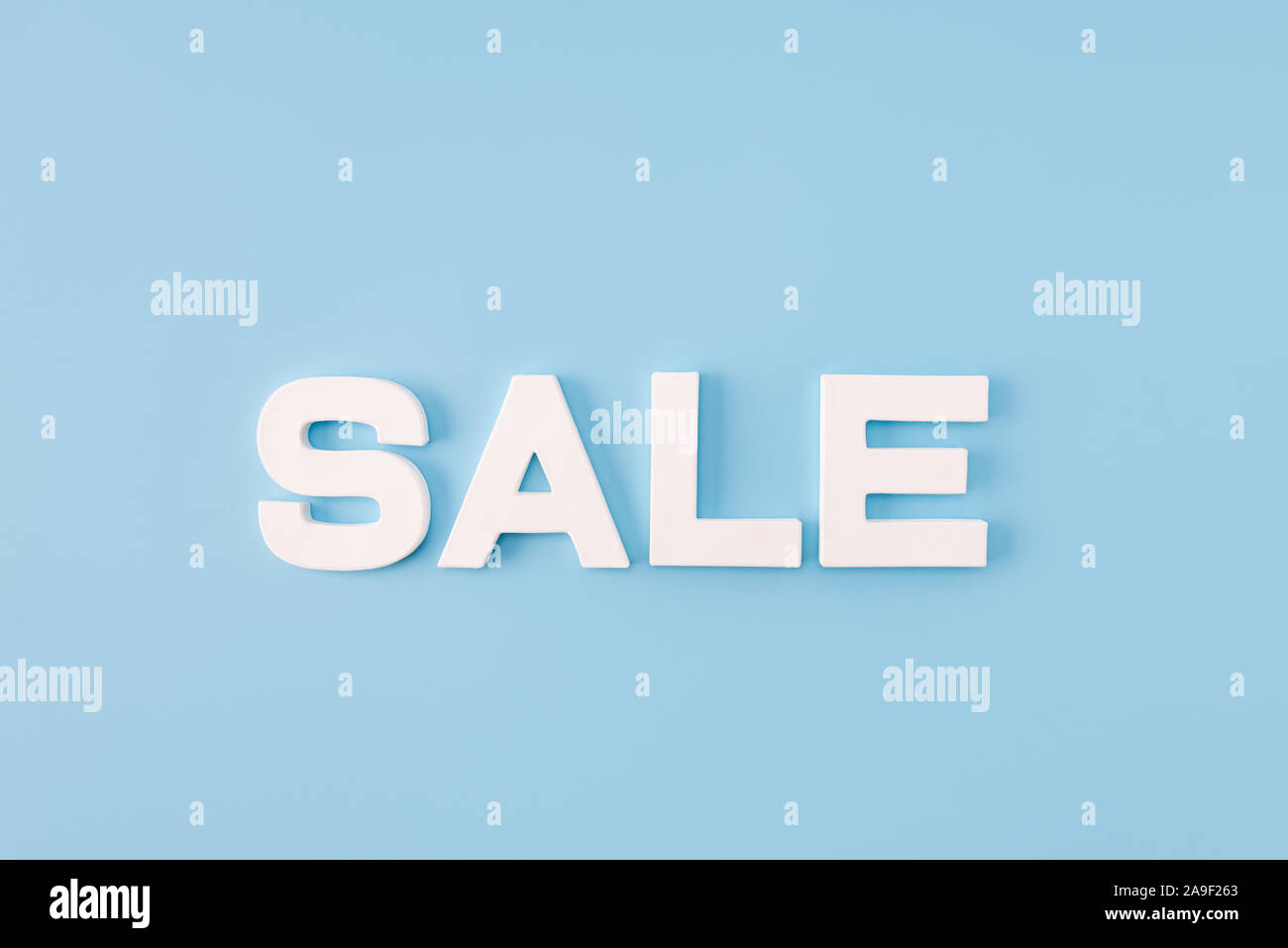 High angle view photo of big sale word announce final season discounts white letters advising client visit shopping mall isolated blue color Stock Photo