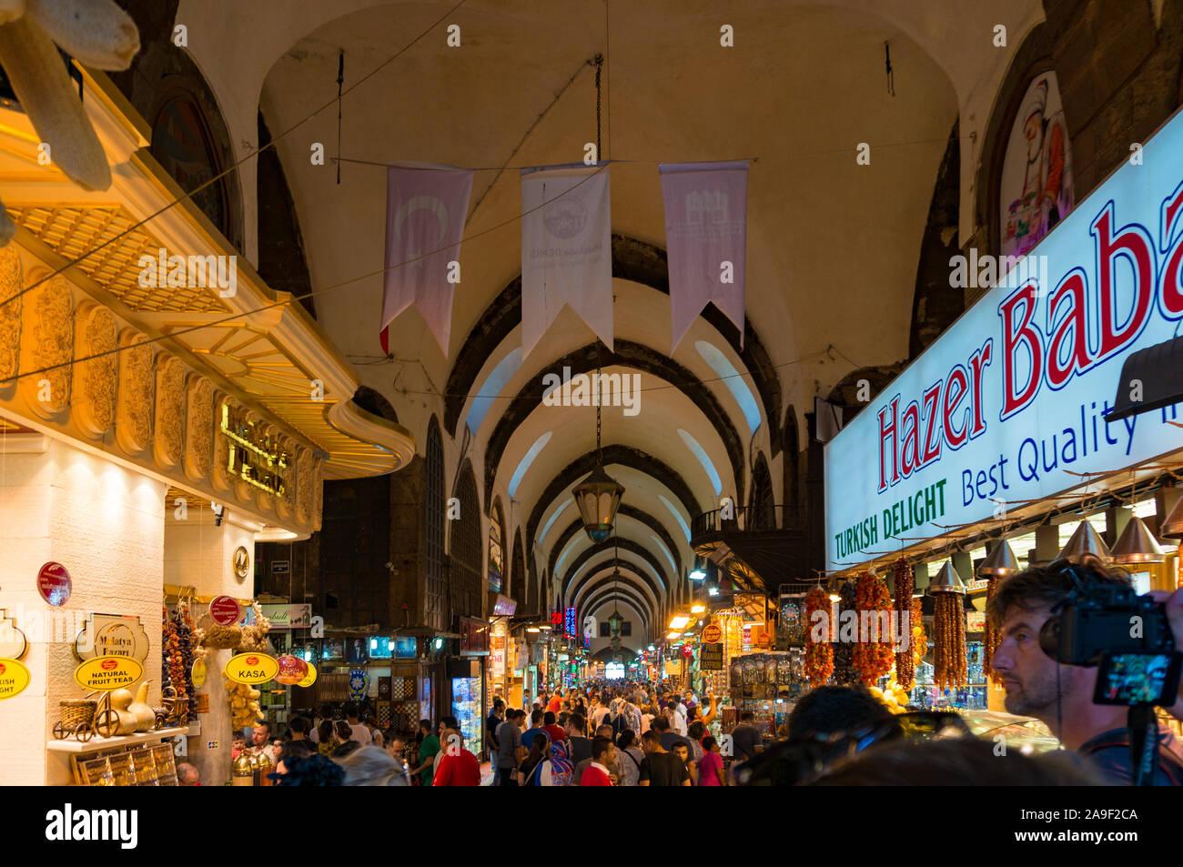 Istanbul, Turkey - August 27, 2013: Grand Bazaar interior with sellers and tourists. Authentic Turkish culture Stock Photo