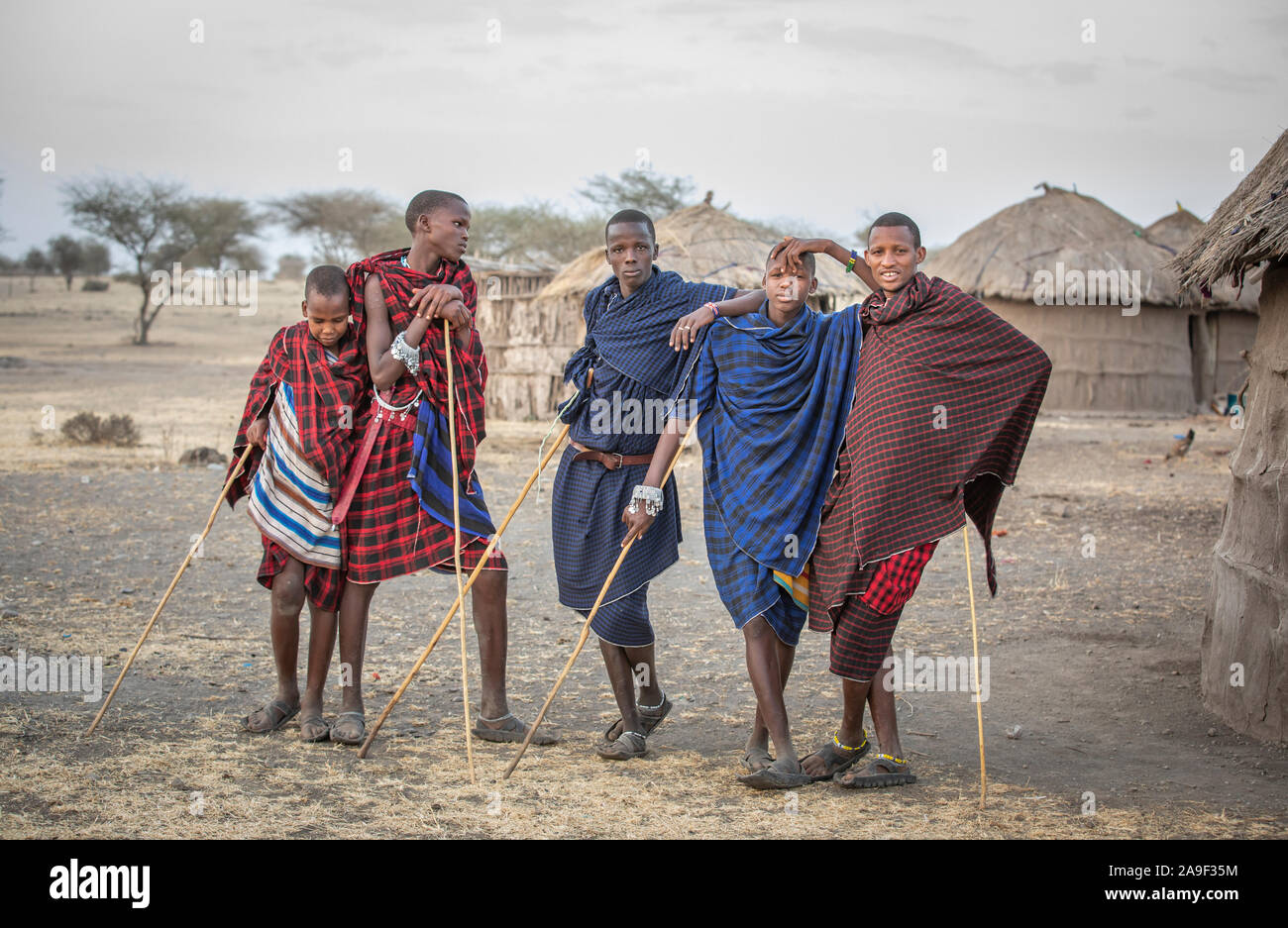Arusha, Tanzania, 9th September 2019: maasai boys in a landscape of Tanzanian Savannah Stock Photo