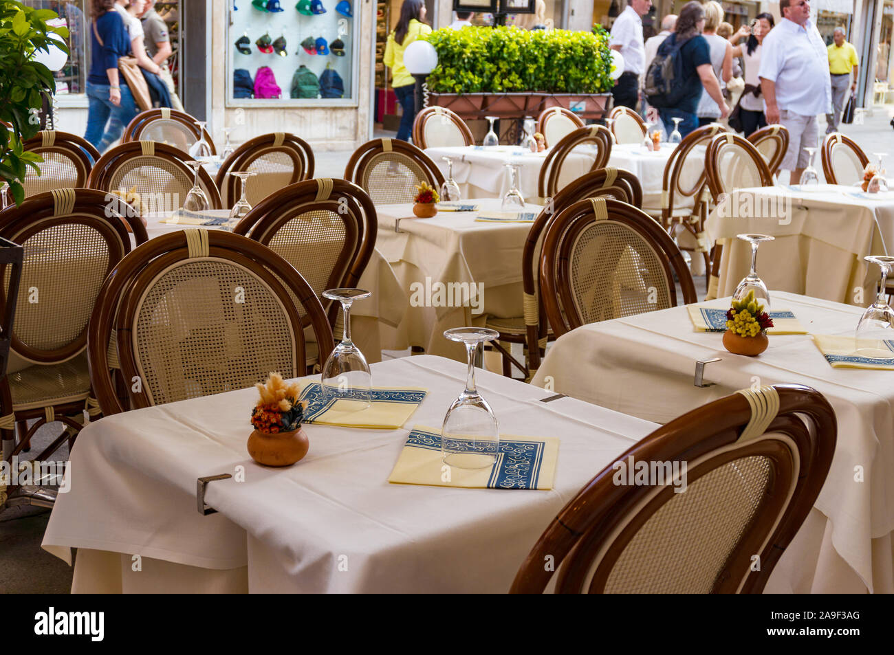 Venice, Italy - September 27, 2013: Tables set for al fresco dining restaurant in Venice Stock Photo