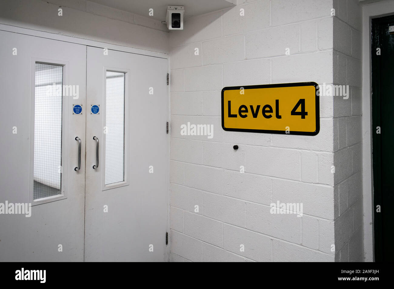A Level 4 sign in a multi story car park. Stock Photo