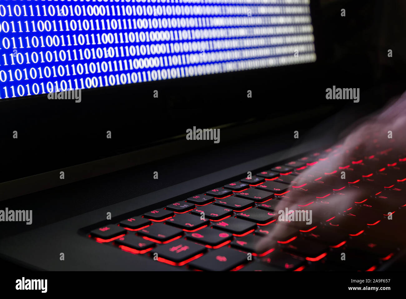 Programming a software on a notebook Stock Photo