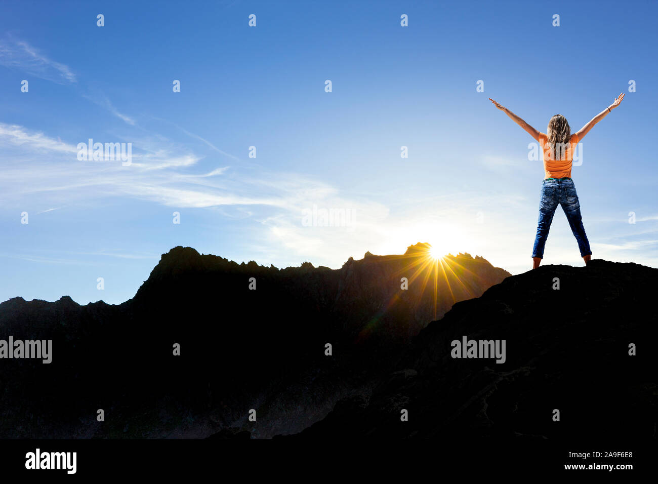 Woman on a hilltop Stock Photo