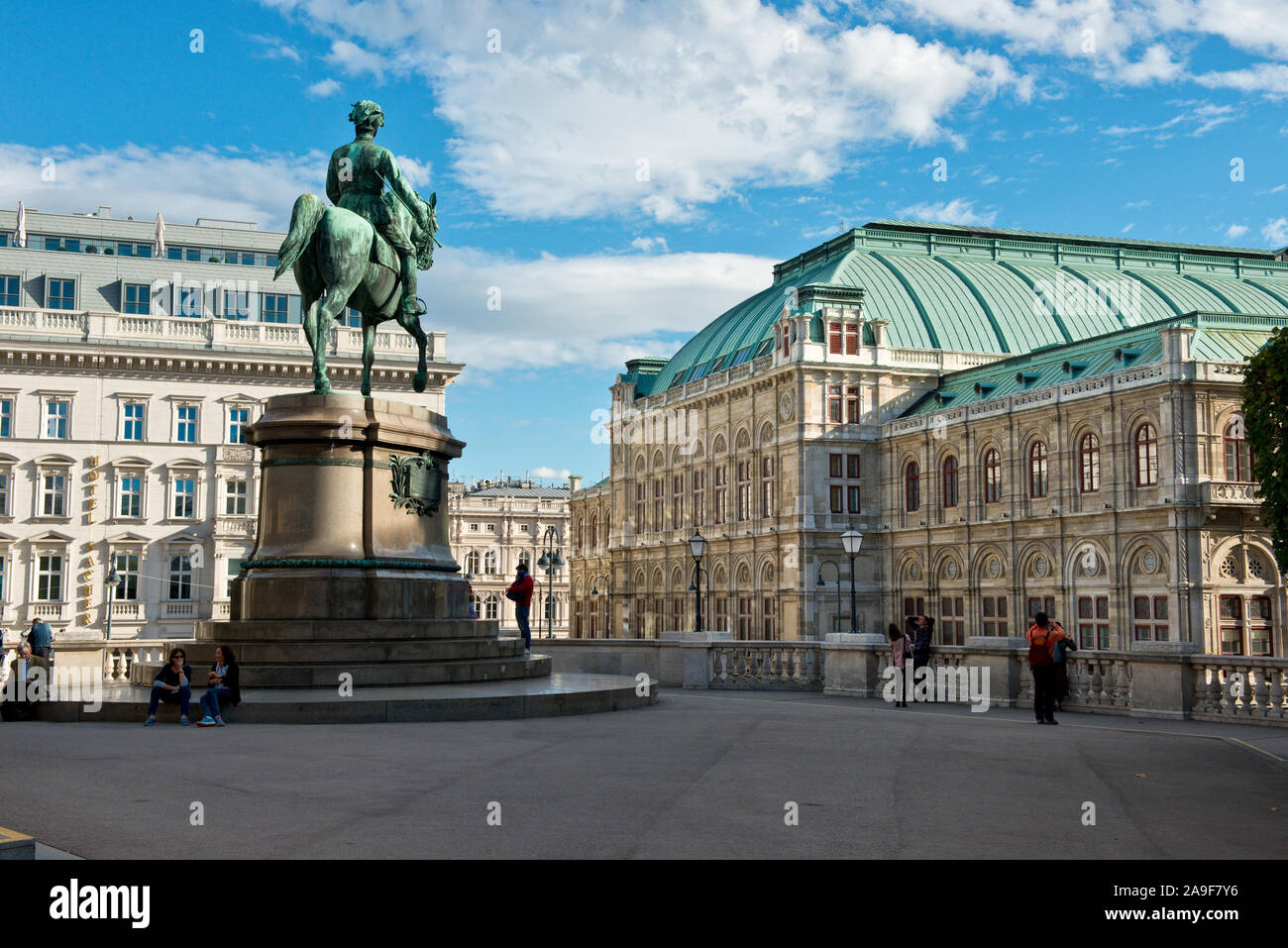 People watching open air live Opera outside the State Opera House in  Karajan Platz Vienna in Austria Stock Photo - Alamy