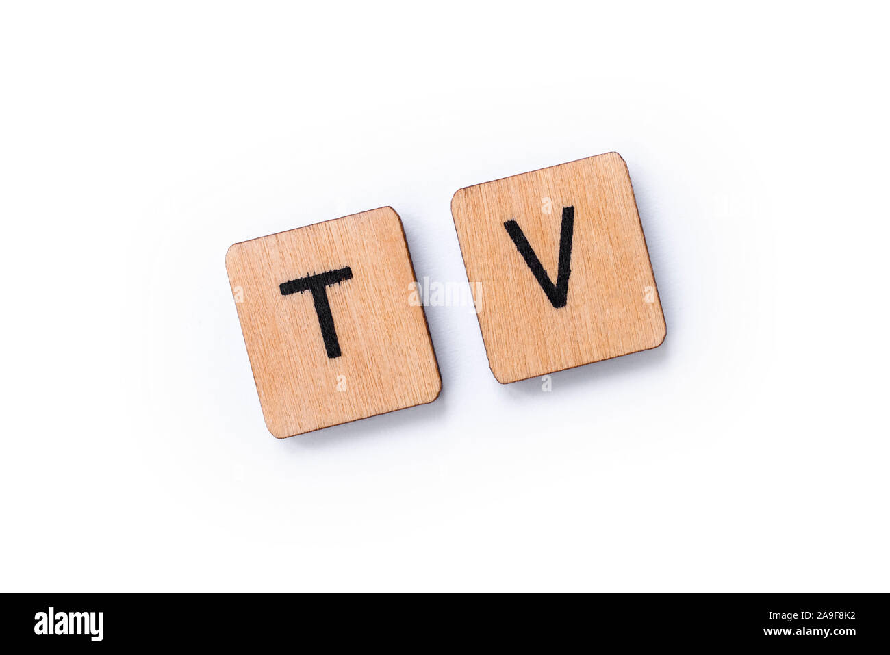 TV, the abbreviation for Television, spelt with wooden letter tiles