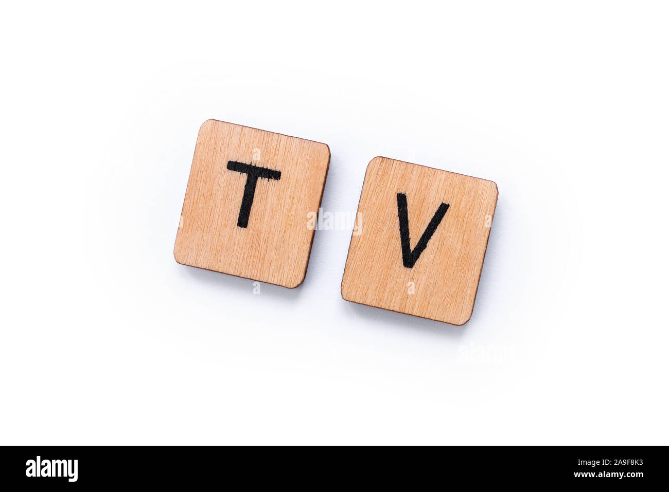 TV, the abbreviation for Television, spelt with wooden letter tiles