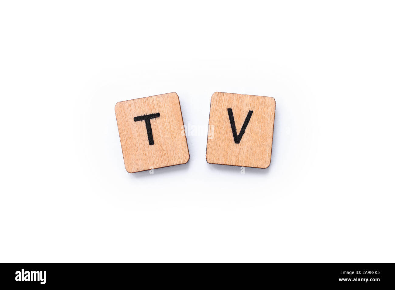 TV, the abbreviation for Television, spelt with wooden letter tiles