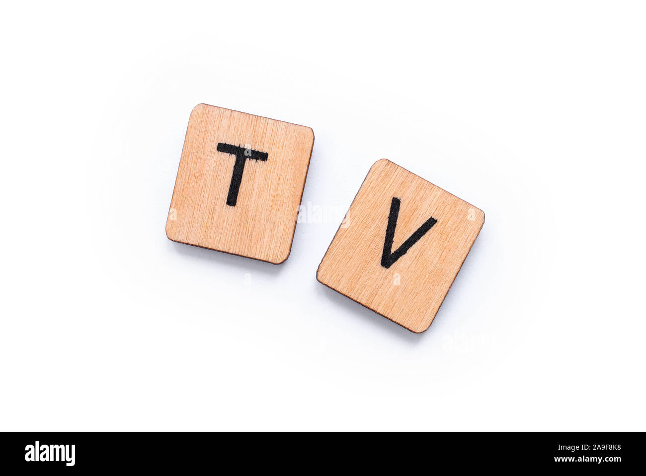 TV, the abbreviation for Television, spelt with wooden letter tiles