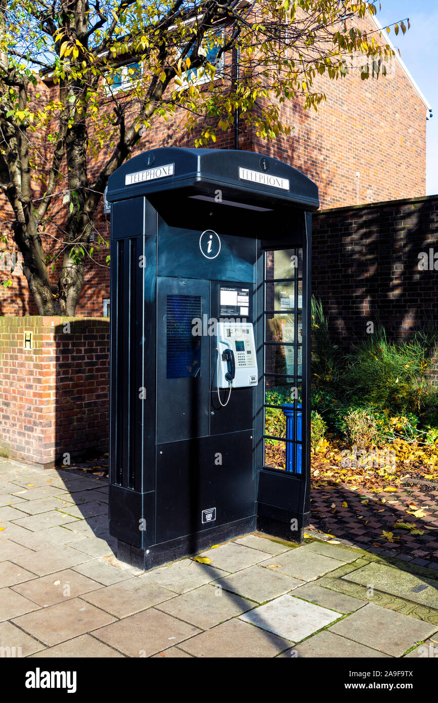 New-style modern black phone box featuring free public access wi-fi and touchscreen with local maps and advertising, London, UK Stock Photo