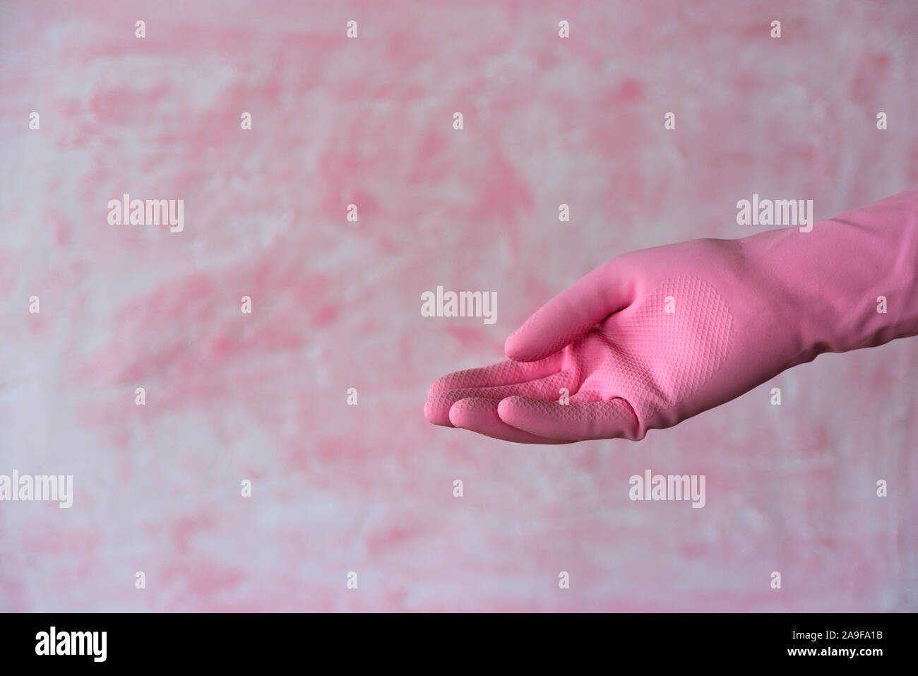 Pinck Hand Pink outstretched hand gesture. Left hander day concept Stock Photo - Alamy