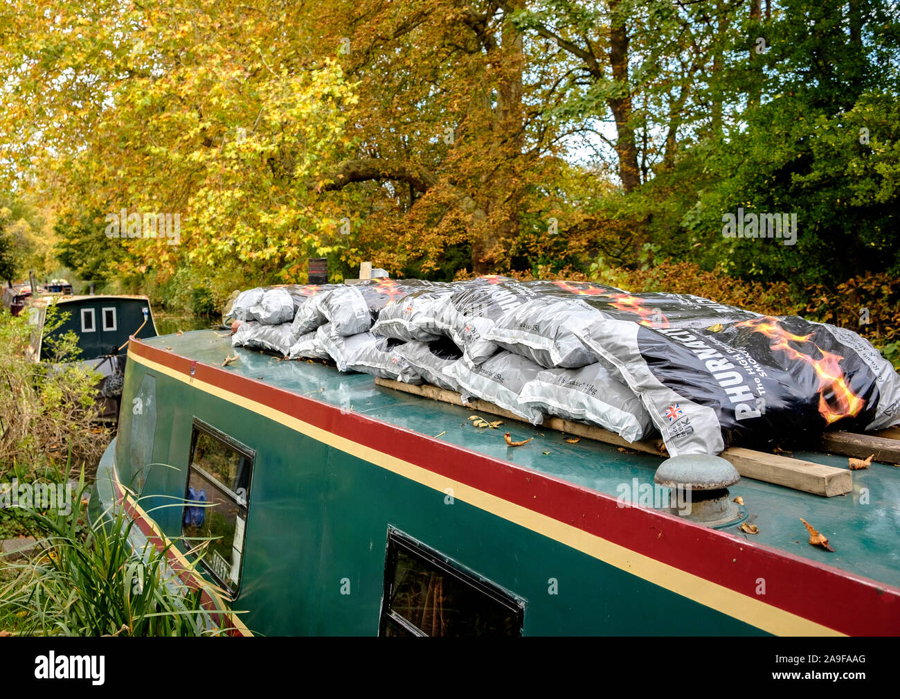 Stocked up for winter, Phurnacite on the roof of a narrowboat on the Hythe Bridge Street Arm of the Oxford Canal in Oxford Stock Photo