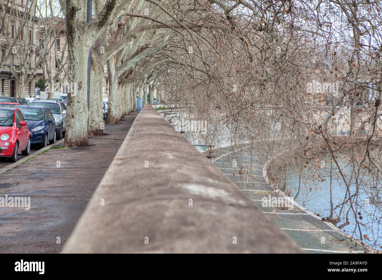 walking path on the riverside with balustrade Stock Photo - Alamy