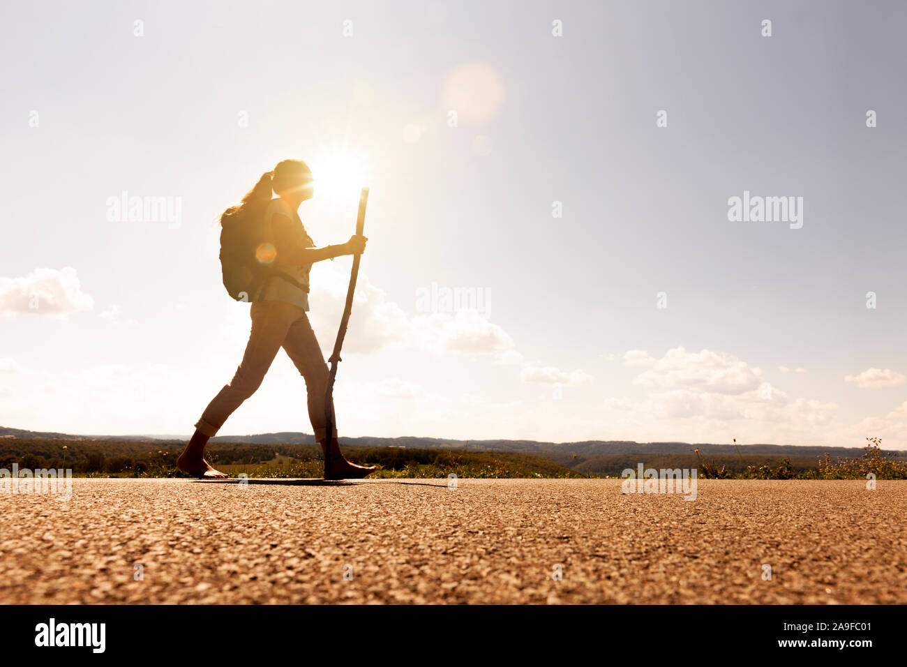 Pilgrim woman at sunset Stock Photo