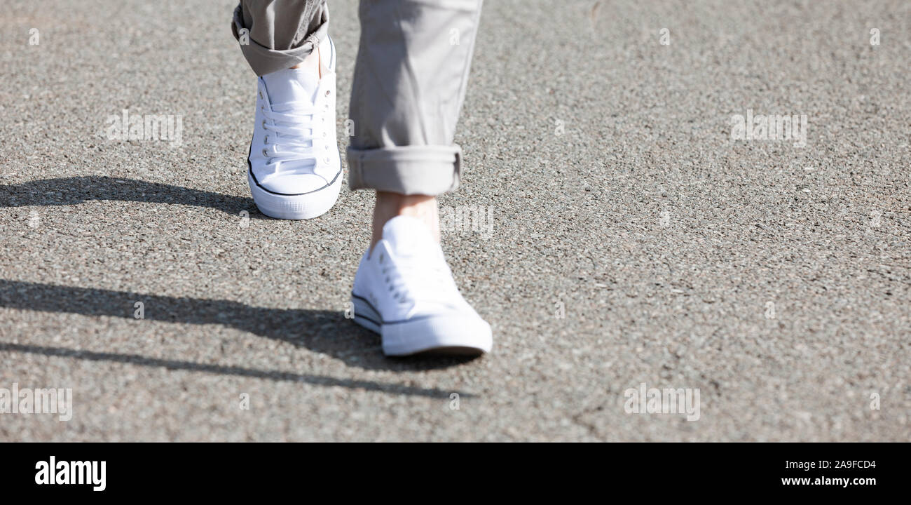 Running feet on asphalt Stock Photo