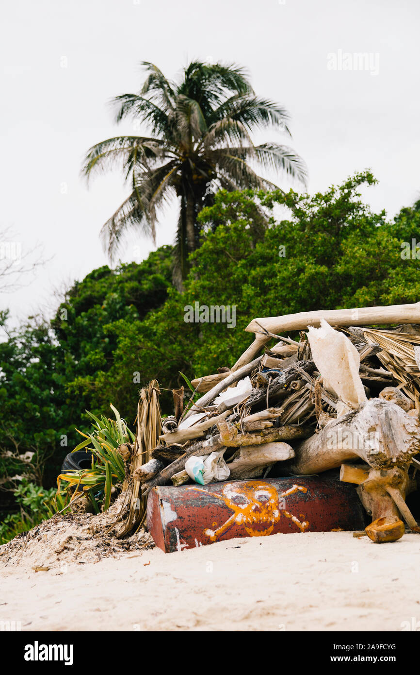 Garbage on the tropical beach as environmental pollution concept Stock Photo