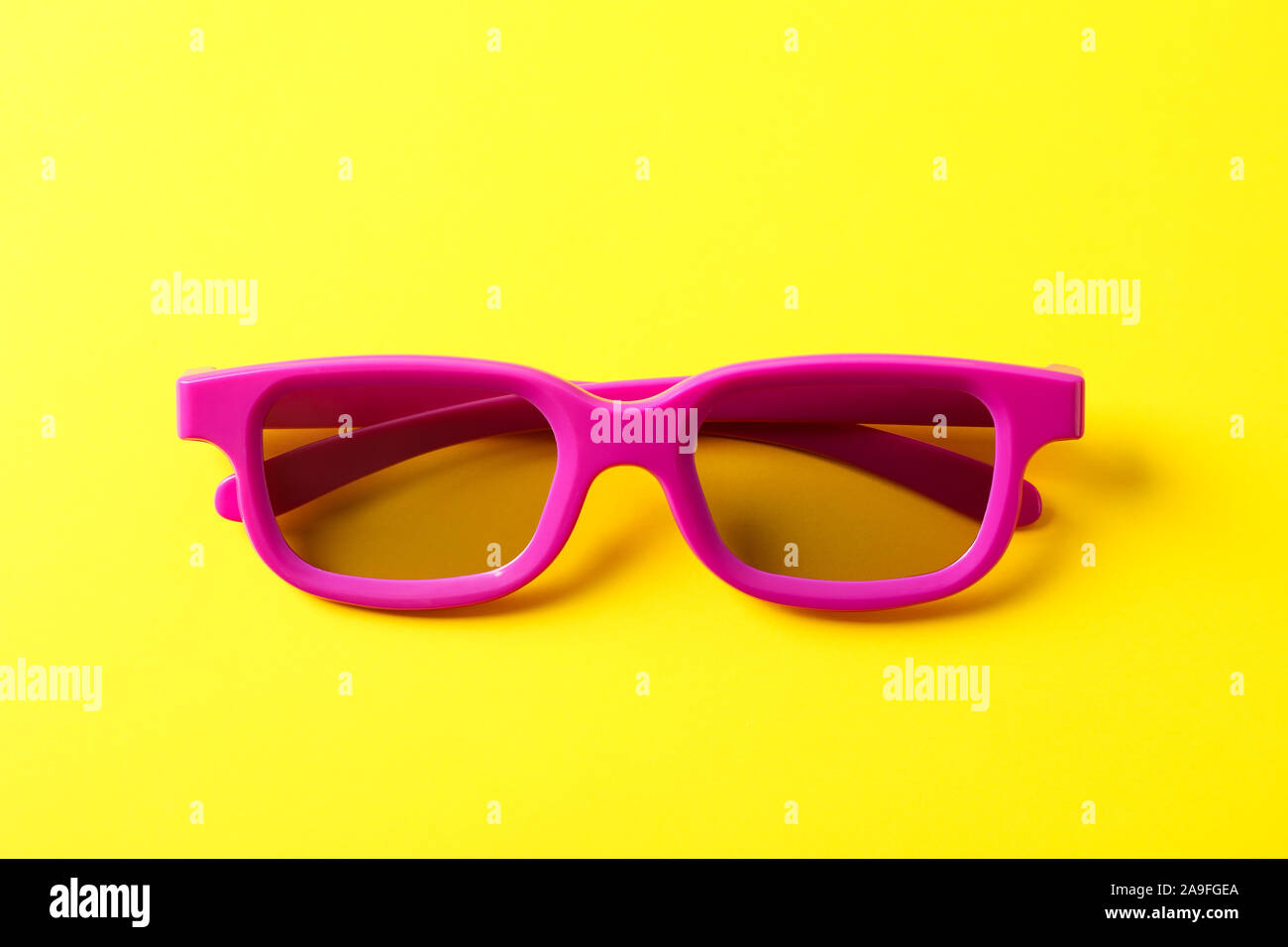 3d glasses on yellow background, close up Stock Photo