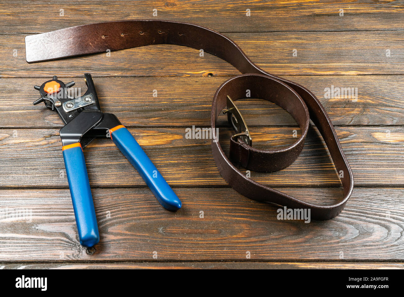 Tool leather hole belt punching hi-res stock photography and images - Alamy