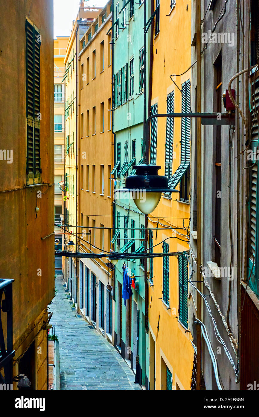 Colorful old narrow side street in  Genoa city, Italy Stock Photo