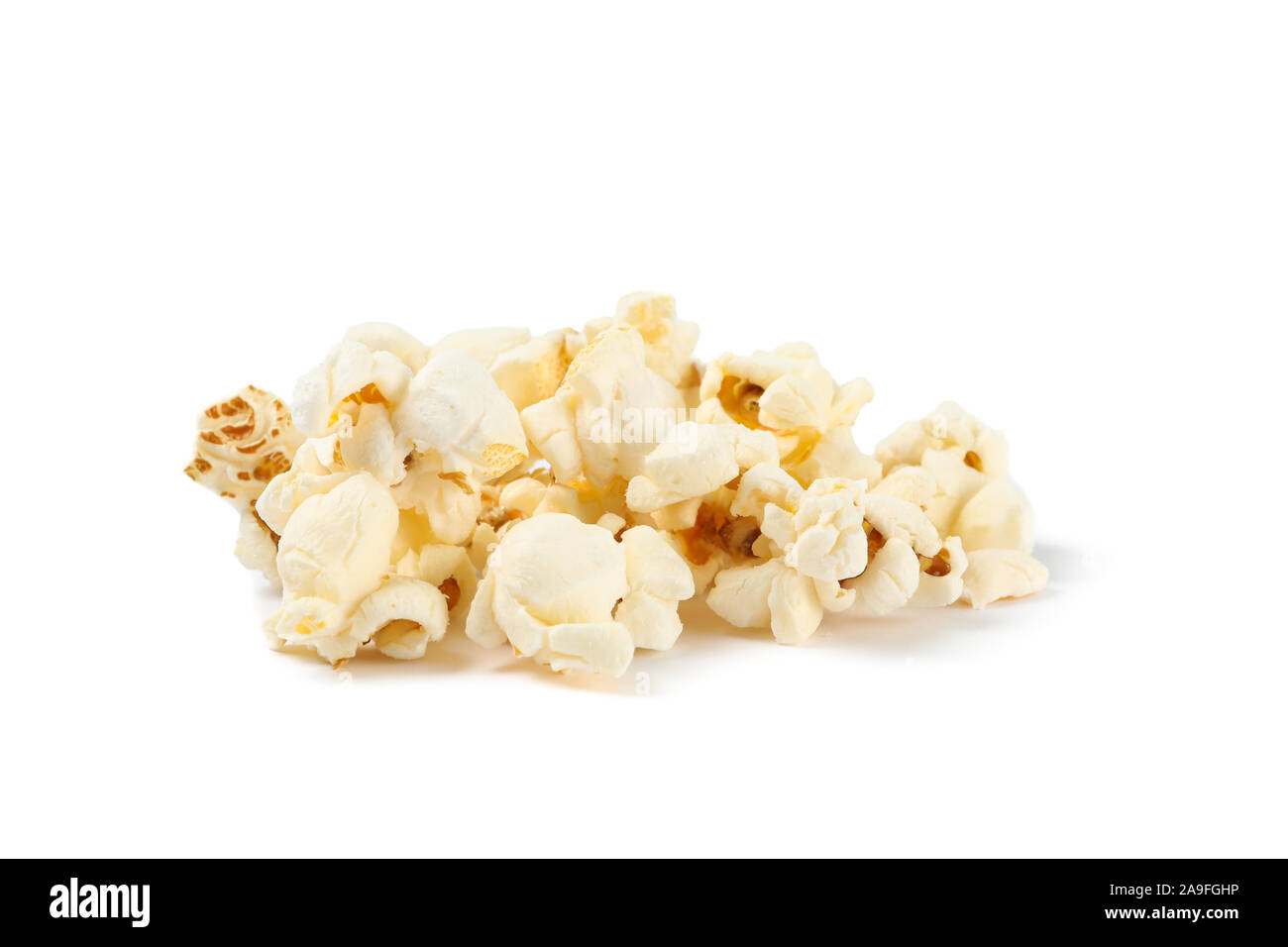 Popcorn pile isolated on white background, close up Stock Photo