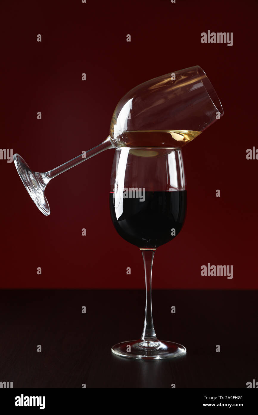 Glasses with wine against red background, copy space Stock Photo