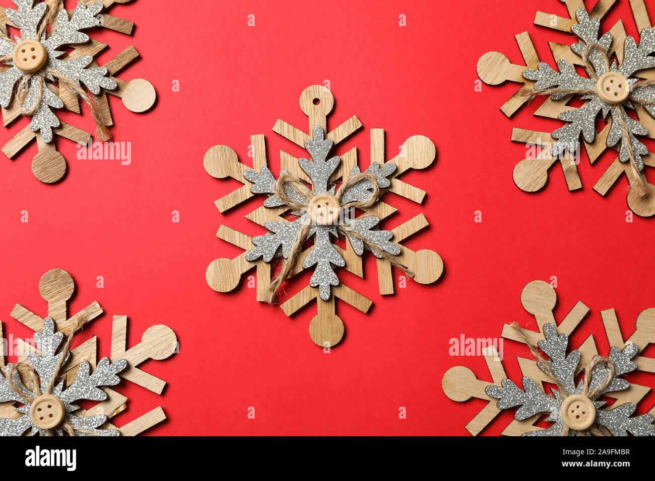 Decorative snowflakes on red background, space for text Stock Photo