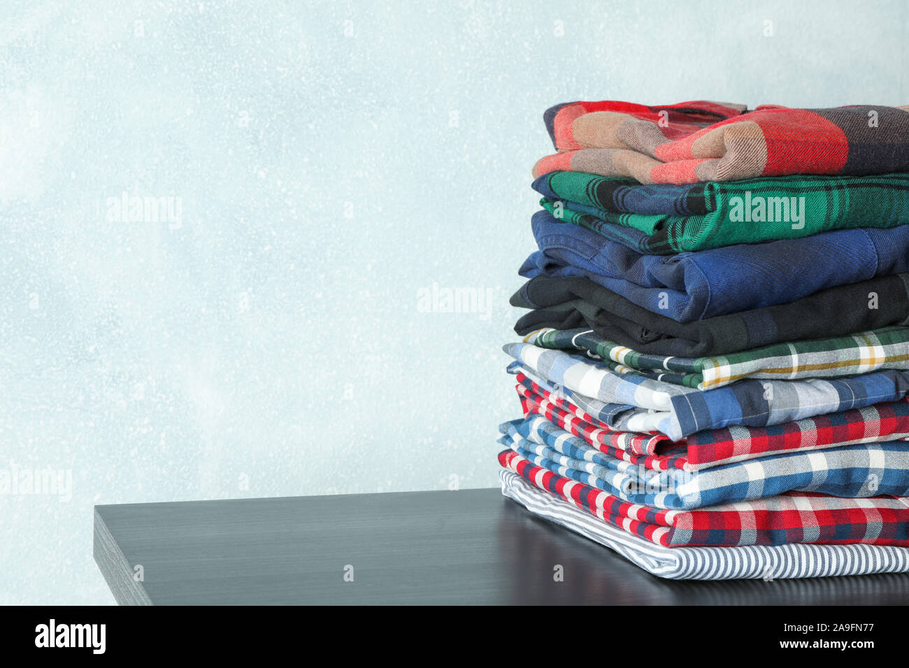Stack folded male shirts hi-res stock photography and images - Alamy