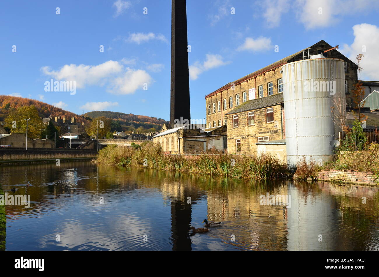Industrial site, Leeds Liverpool canal, Bingley, West Yorkshire Stock Photo