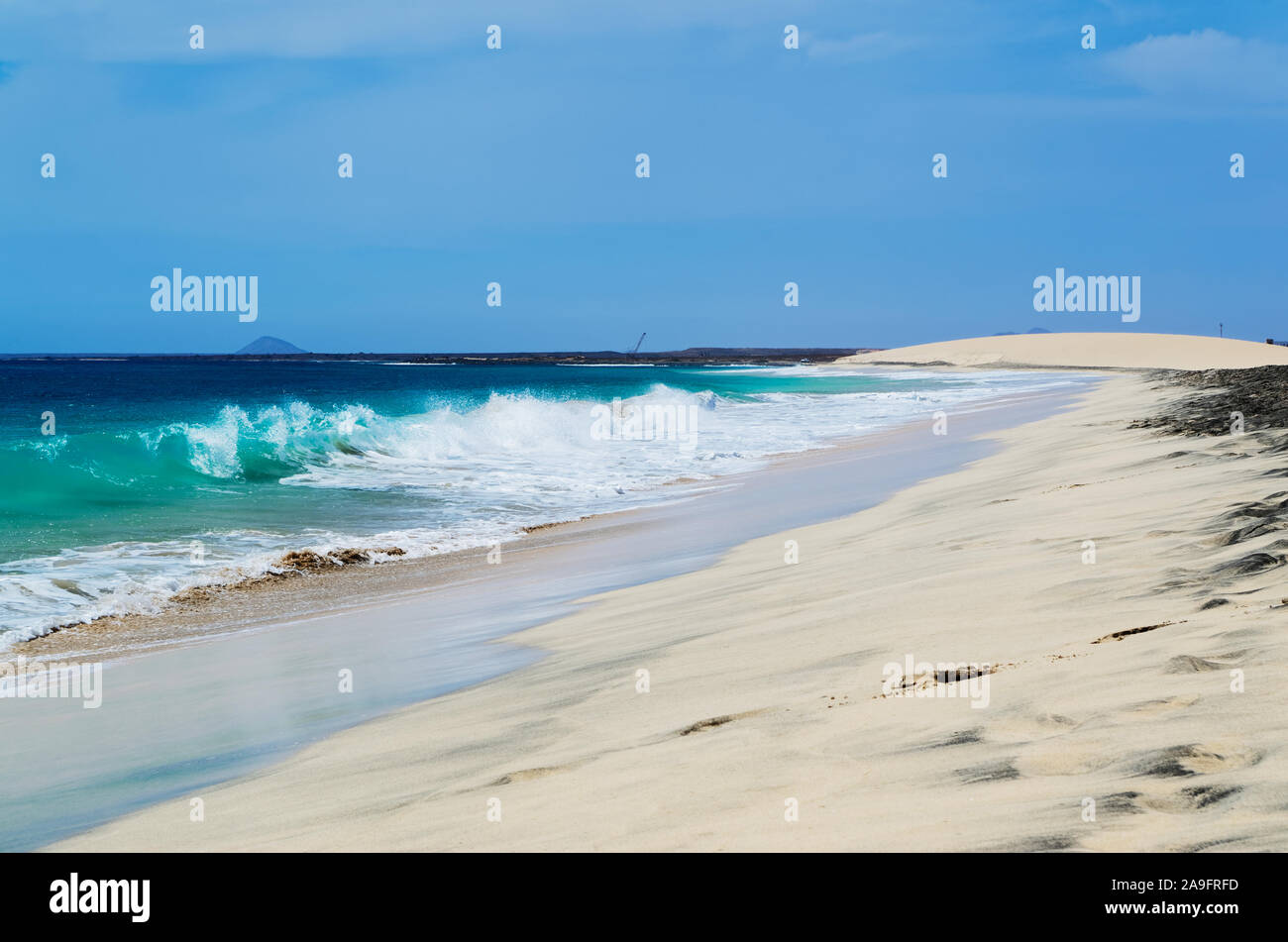 Ocean waves breaking at Cape Verde sandy beach on the island Sal Stock Photo