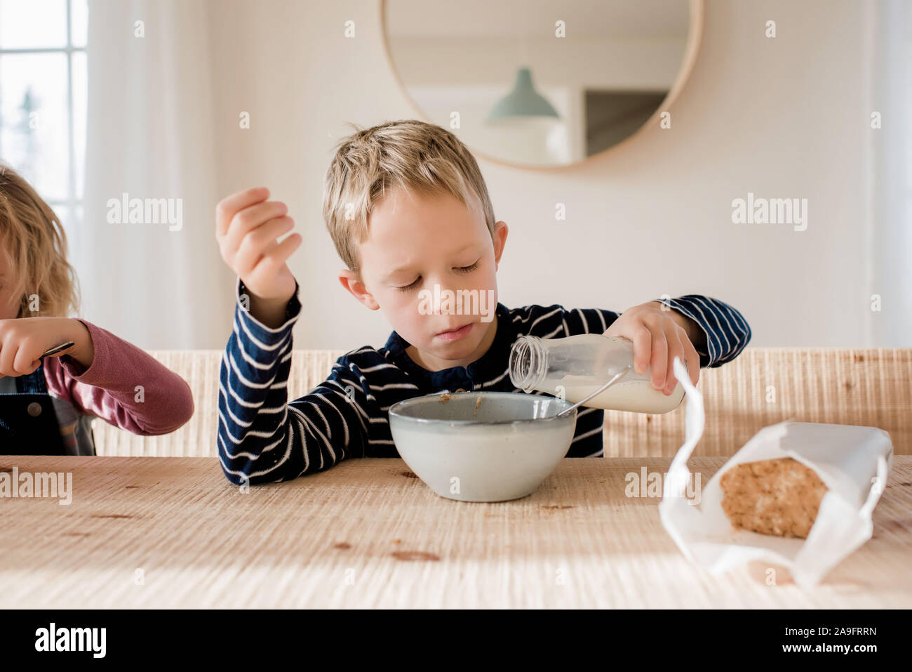 young boy during milk on his breakfast at home before school Stock Photo