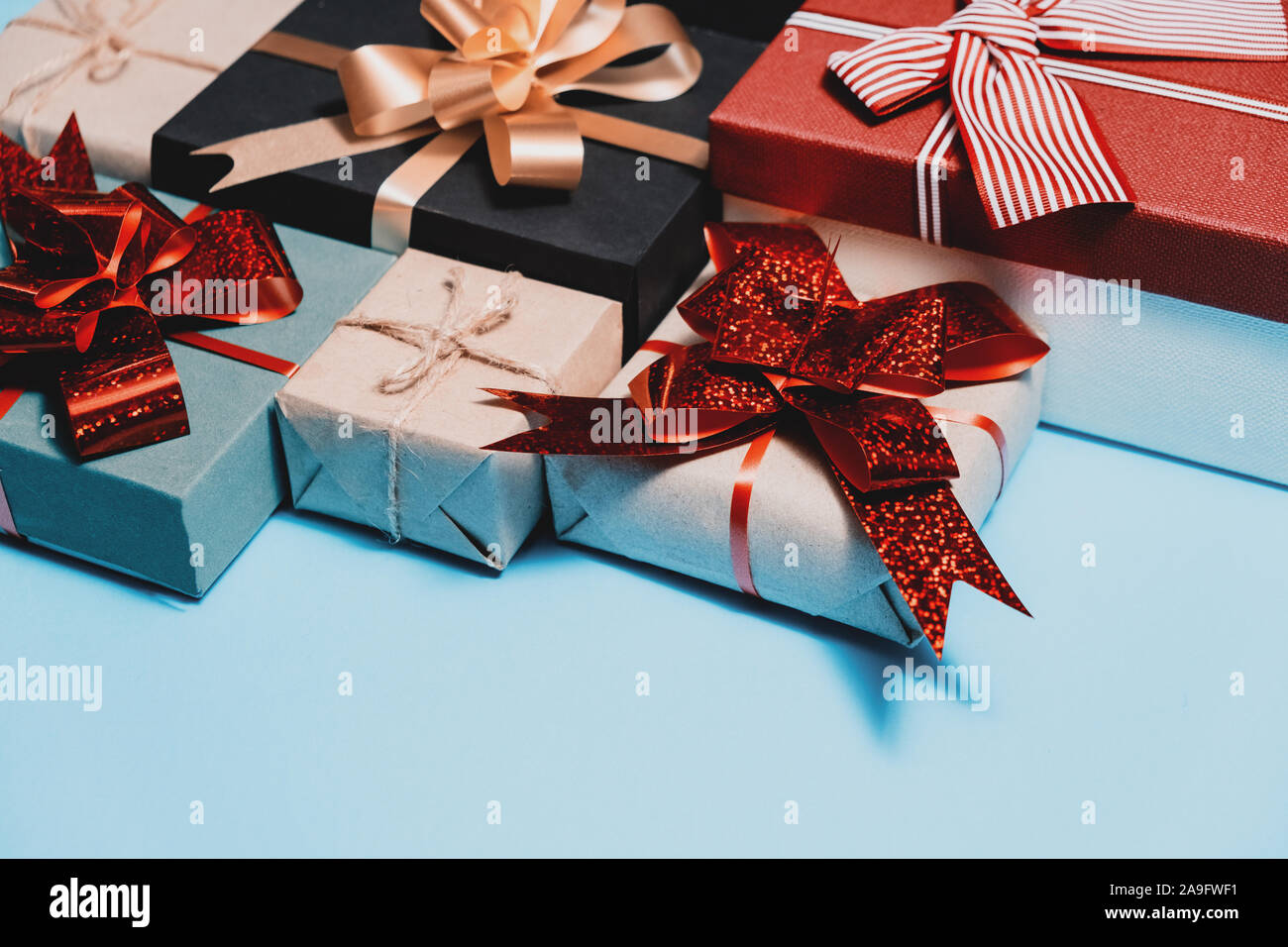 Holiday composition. Various handmade gift boxes on pastel blue background. Birthday concept. Flat lay, top view, copy space Stock Photo