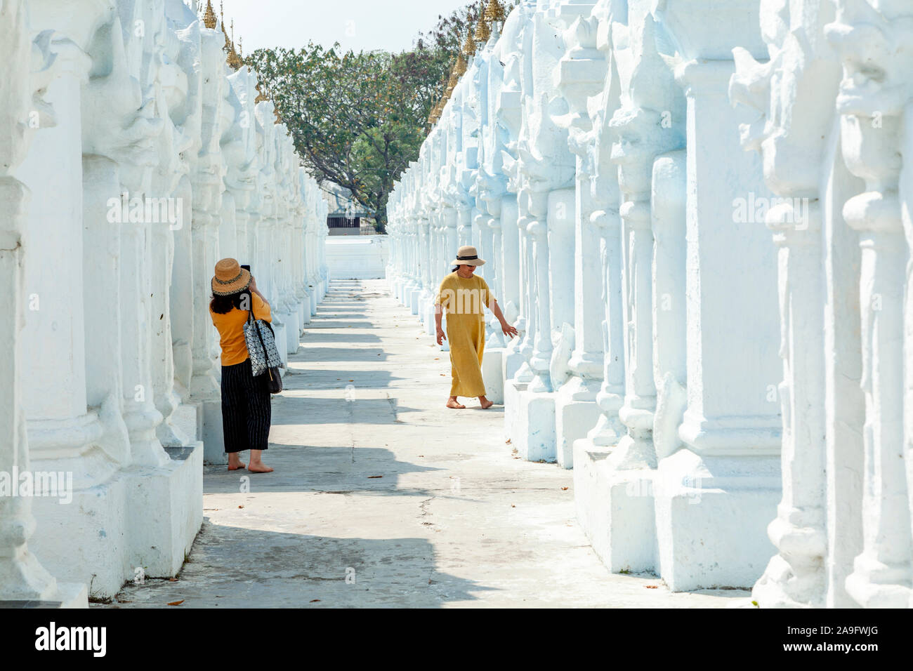 Visitors At The Kuthodaw Pagoda, Mandalay, Myanmar. Stock Photo