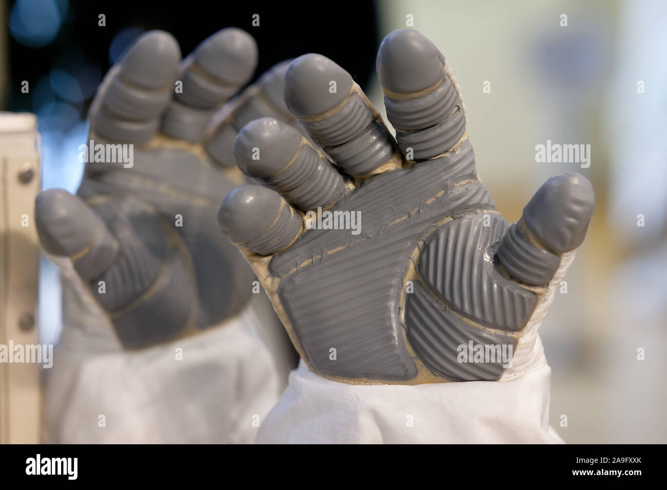 Cologne, Germany. 15th Nov, 2019. Astronaut gloves can be seen at an event at the European Astronaut Centre (EAC) on the occasion of outdoor use at the ISS. ESA astronaut Luca Parmitano and NASA astronaut Andrew Morgan are to repair the alpha magnetic spectrometer (AMS-02) at the ISS. Credit: Henning Kaiser/dpa/Alamy Live News Stock Photo