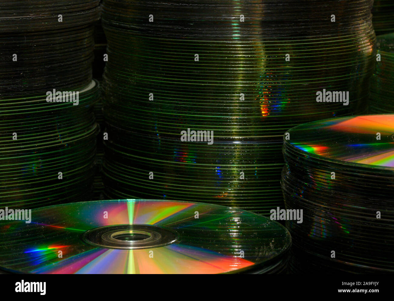 Creative view of stacks of old CD's and DVD's Stock Photo Alamy
