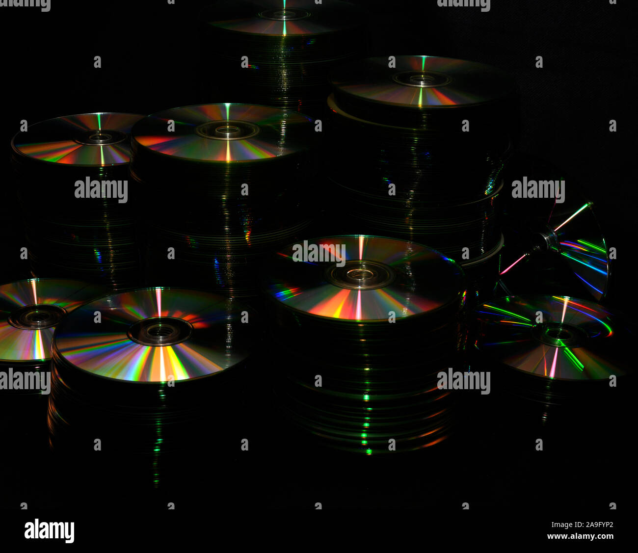 Creative view of stacks of old CD's and DVD's Stock Photo Alamy
