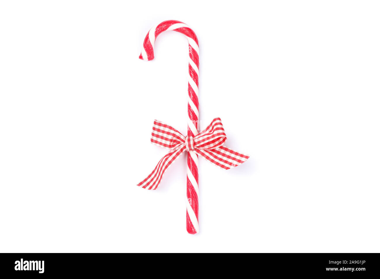 Sweet candy cane with bow isolated on white background Stock Photo - Alamy