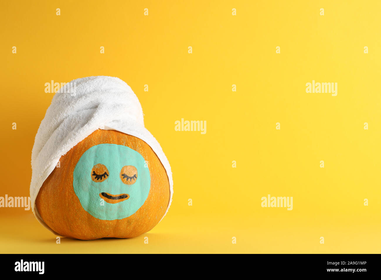 Download Pumpkin With Facial Mask And Towel On Yellow Background Copy Space Stock Photo Alamy Yellowimages Mockups
