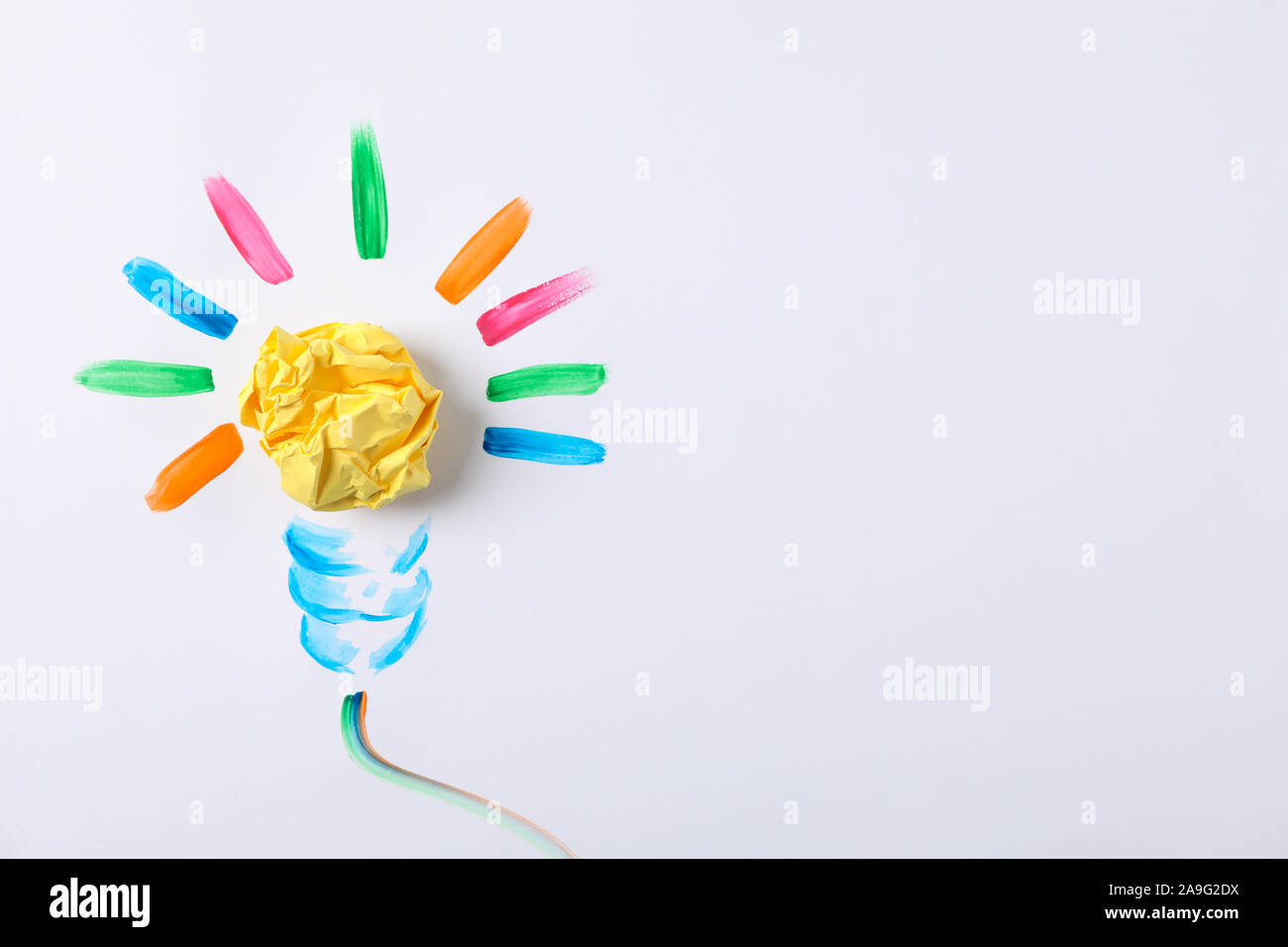 Drawn light bulb and paper ball on white background, space for text Stock Photo