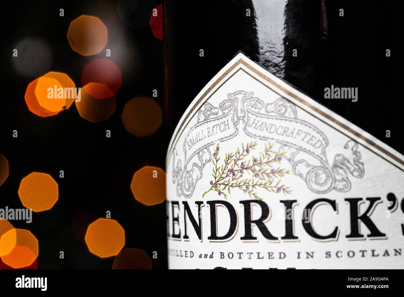 Hendrick's Gin bottle in front of Christmas lights. Hendrick's Gin has