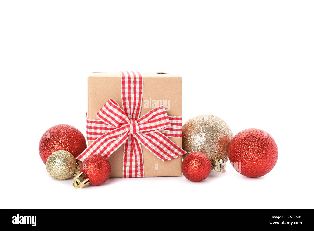 Gift box and Christmas baubles isolated on white background Stock Photo ...
