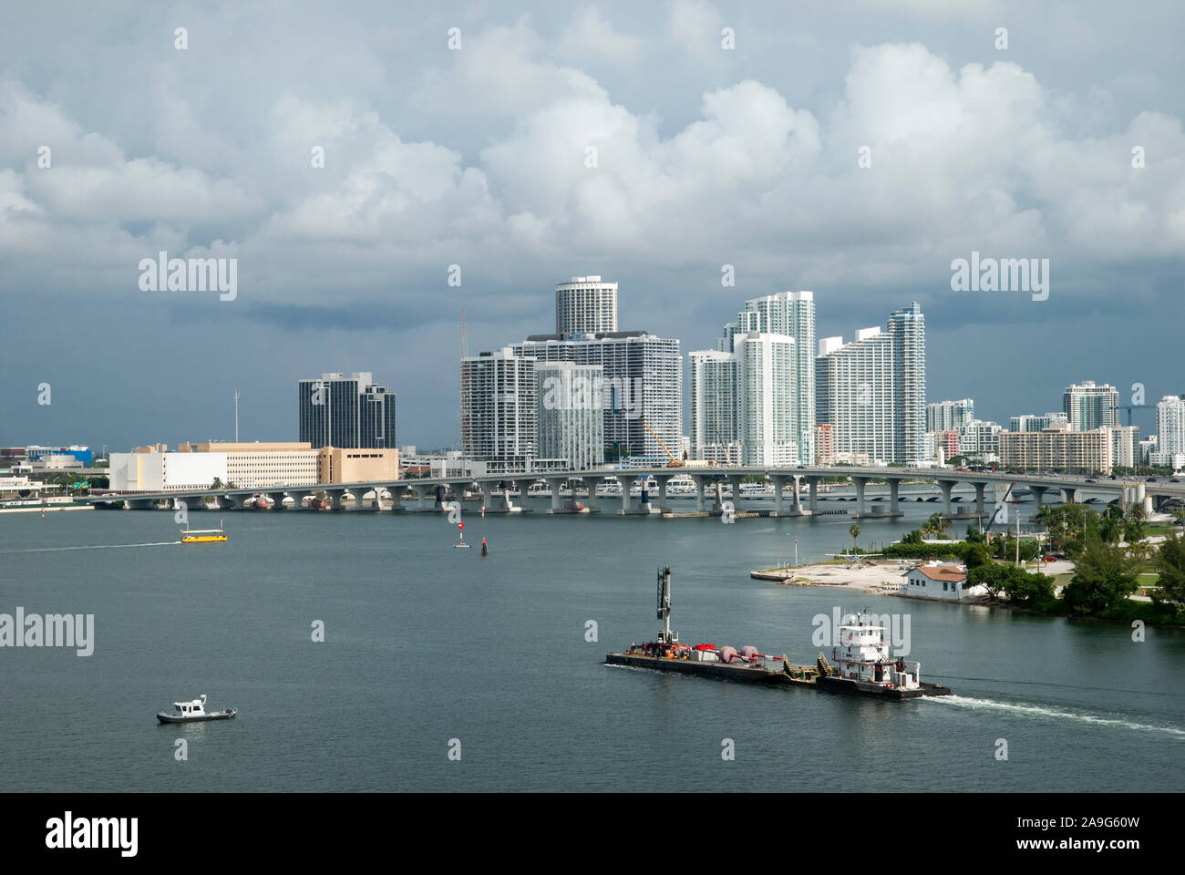 The busy Miami Main Channel water traffic under rainy clouds (Florida). Stock Photo