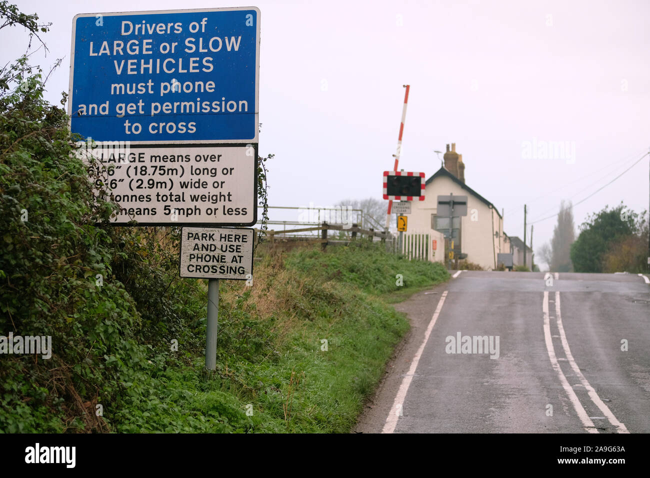 November 19 Warning Signs To Drivers Of Large And Slow Vehicles At An Un Manned Railway Level Crossing Near Stoke St Gregory Somerset Uk Stock Photo Alamy