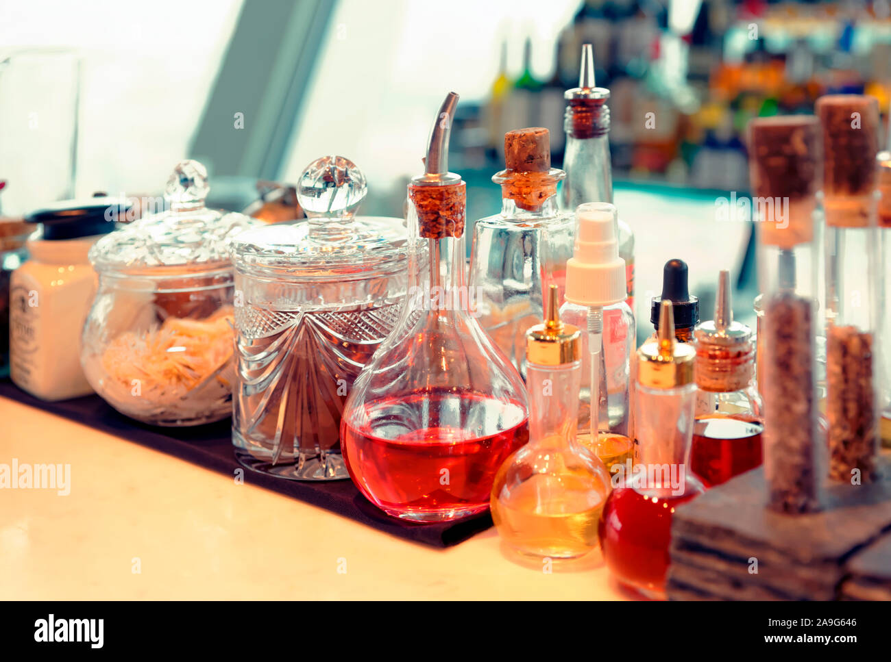 Bitters and  infusions on bar counter, toned Stock Photo