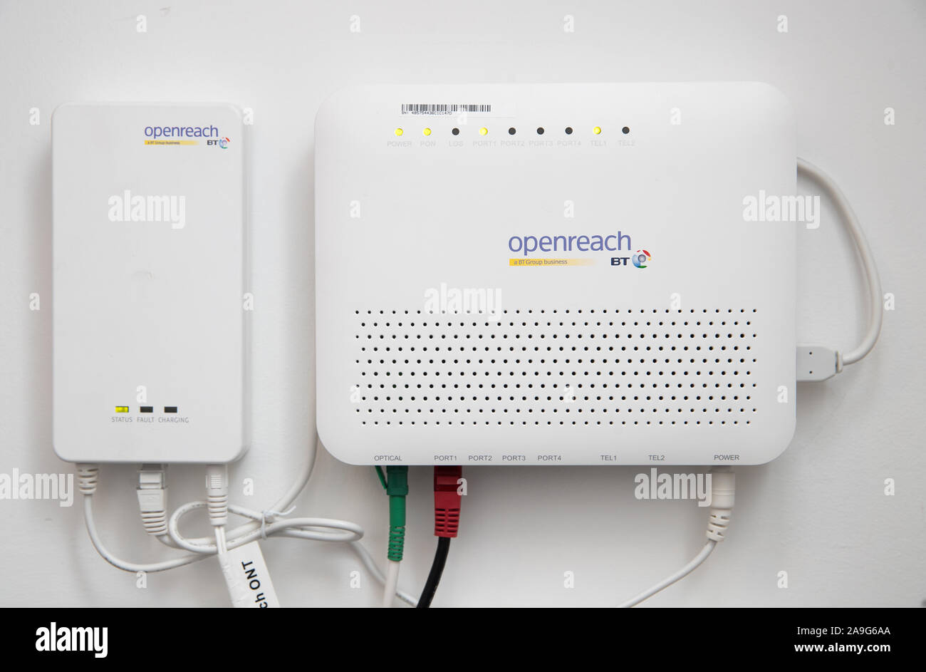 A BT Openreach fibre modem inside a residential property as shares in the  company dropped nearly 4% after the Labour Party announced plans to turn  broadband into a public service Stock Photo -