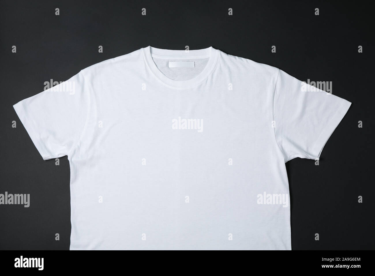 Blank white t-shirt on black background 