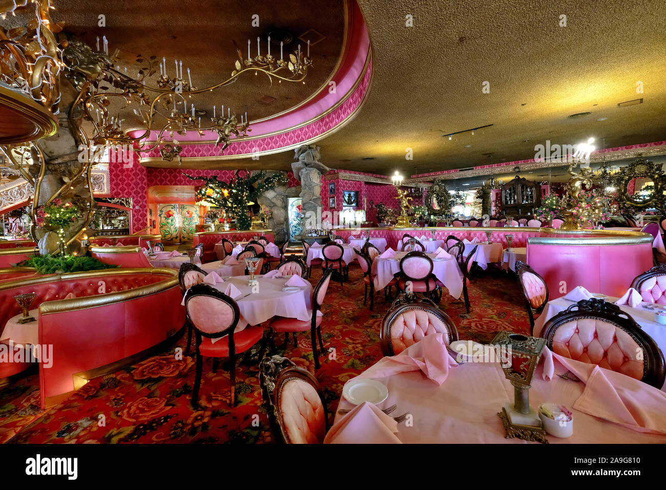 Restaurant with chandelier in the quirky kitsch hotel Madonna Inn on Highway 1, California, USA Stock Photo
