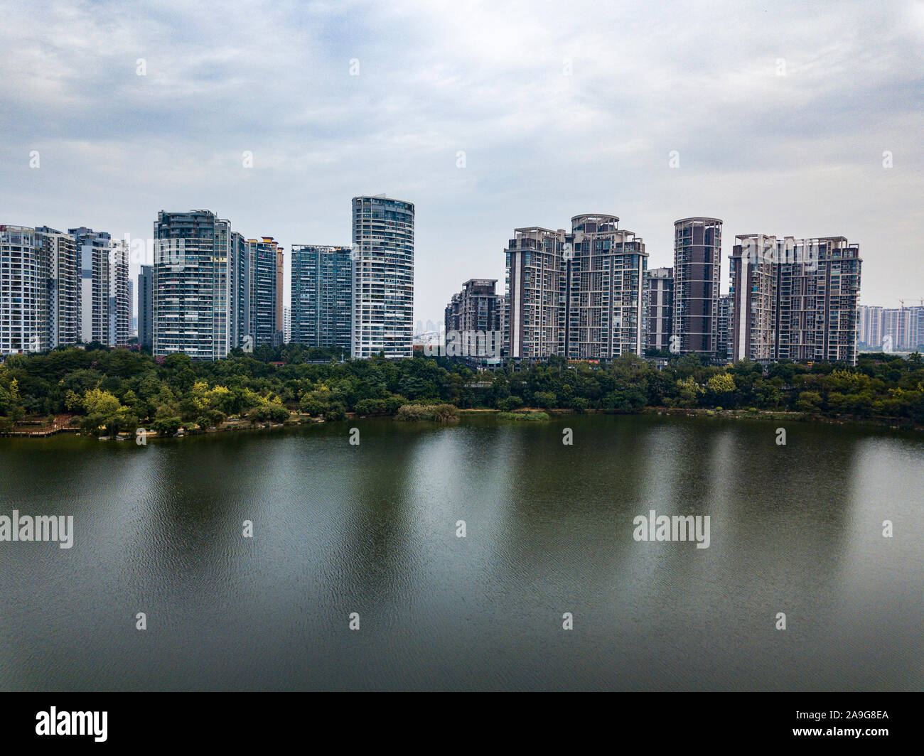 Excellent green residential area by the city lake Stock Photo - Alamy