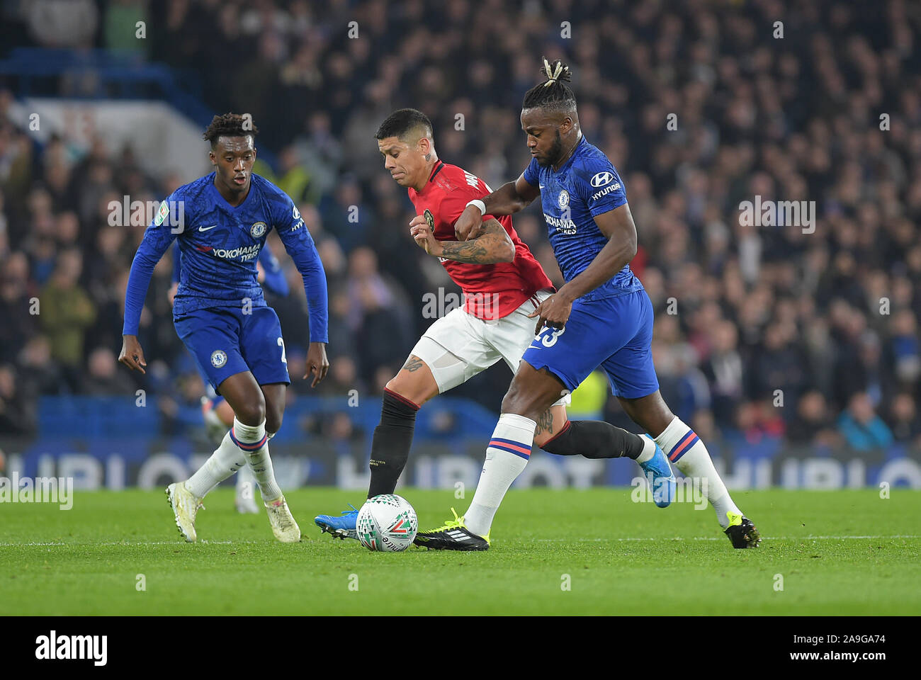 Michy Batshuayi clashes with Marcos Rojo of Manchester Utd during the Chelsea vs Manchester United EFL Carabao Cup Round of 16 tie at Stamford Bridge Stock Photo