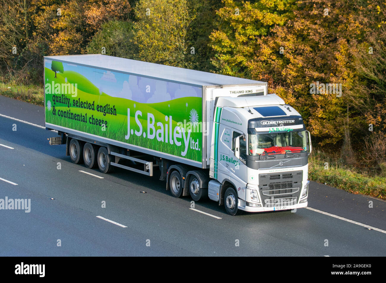 J.S.BAILEY Ltd English & Continental cheese; Haulage delivery trucks, lorry, transportation, truck, cargo, Volvo vehicle, delivery, commercial transport, industry, on the M61 at Chorley, UK Stock Photo